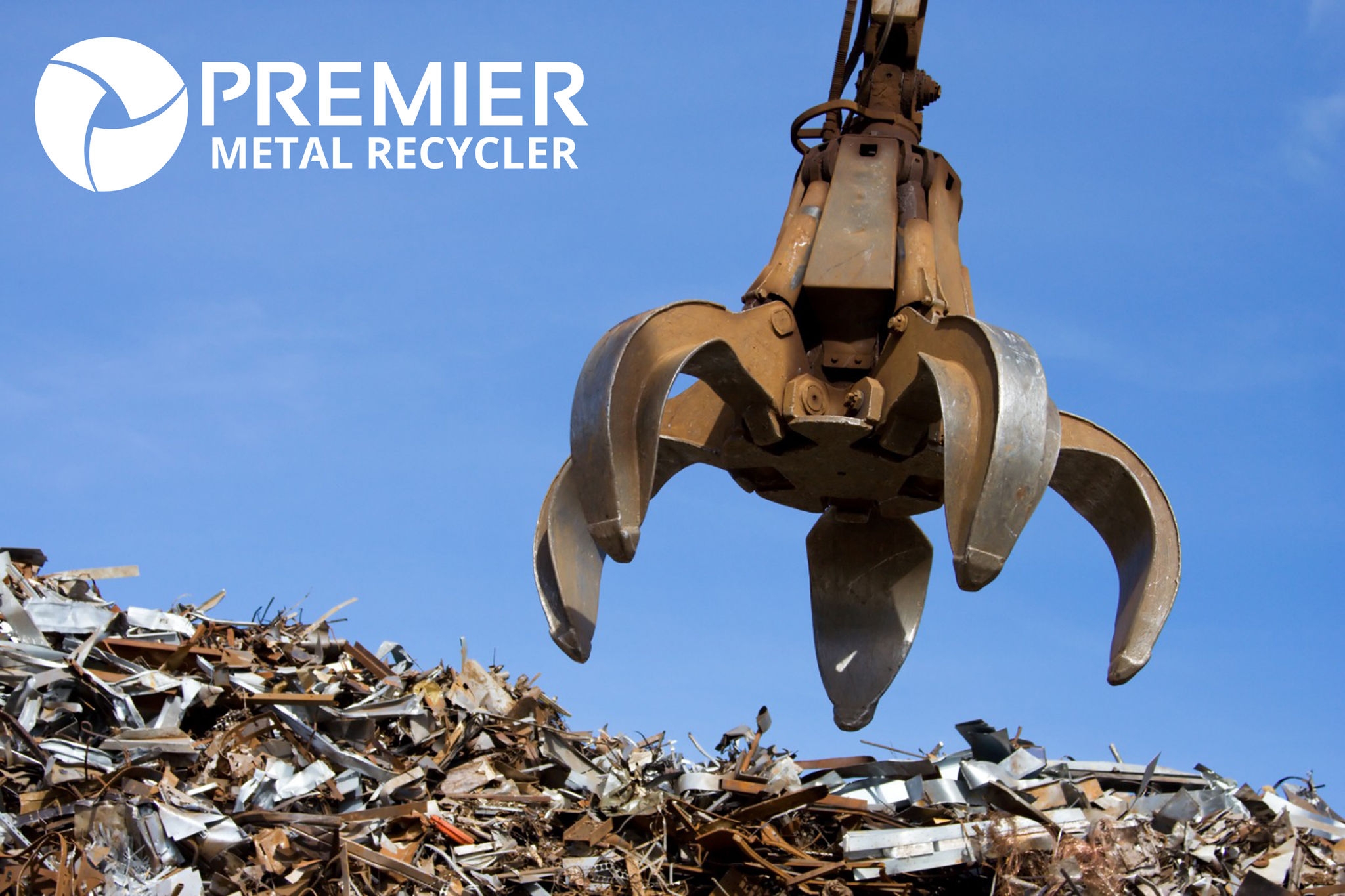 machine-dumping-scrap-metal-in-junk-yard